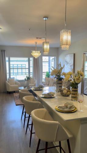 a dining room with a long table and chairs at Atlanta Beltline Luxury Suite in Atlanta
