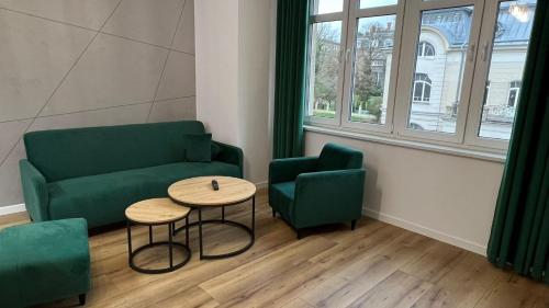 a living room with a couch and a table and chairs at CityCenterApartments/M32/6 in Bielsko-Biała