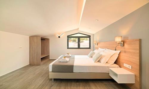 Ένα ή περισσότερα κρεβάτια σε δωμάτιο στο Moonlights Villas Heated Pool