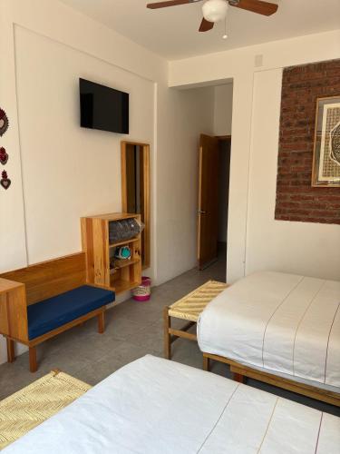 Postel nebo postele na pokoji v ubytování Santa Cecilia Hotel