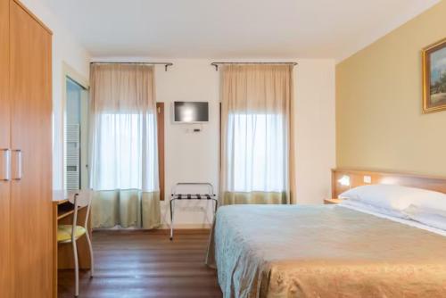 Postel nebo postele na pokoji v ubytování Agriturismo Colombera