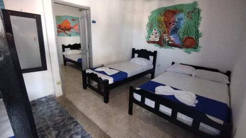 מיטה או מיטות בחדר ב-Hotel Kelly Mar