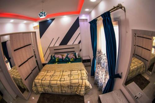 a bedroom with two beds in a room at Ryan Apartments in Hurghada
