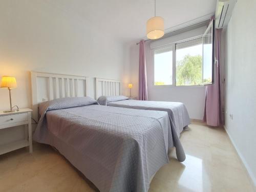 A bed or beds in a room at Reserva del Parque