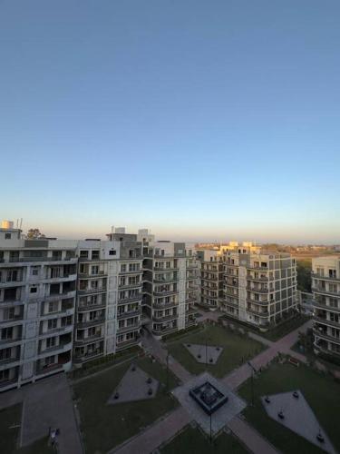 an aerial view of a city with tall buildings at Hazel : Minimalist Apartment in Amritsar