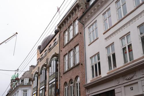 a row of tall buildings on a city street at Latin Quarter by Daniel&Jacob's in Copenhagen