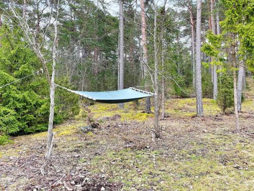 a hammock in the middle of a forest at 4 star holiday home in Klintehamn-By Traum in Klintehamn