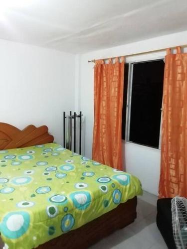 Ένα ή περισσότερα κρεβάτια σε δωμάτιο στο apartamento aura