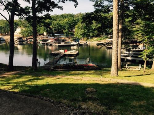a view of a marina with boats in the water at Elite Retreat for family and friends; Lake Front, launch, dock, boat slips in Lake Ozark