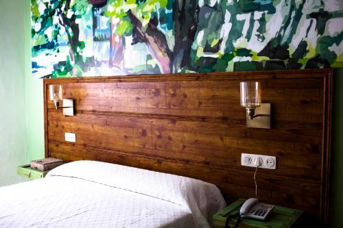 Postel nebo postele na pokoji v ubytování Hotel Sur Utopia