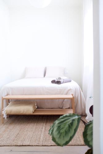 a bedroom with a bed with a white bedspread at Vanilla! 1 Bedroom Apartment in Puerto de la Cruz