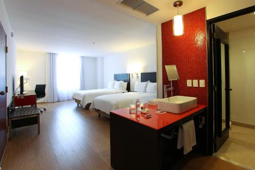 Ένα ή περισσότερα κρεβάτια σε δωμάτιο στο Fiesta Inn Express Naucalpan