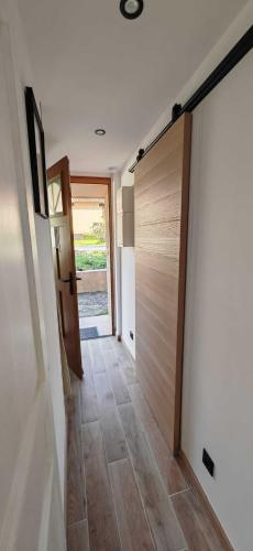 a hallway with a sliding door in a house at La bergerie de Cupabia in Serra-di-Ferro