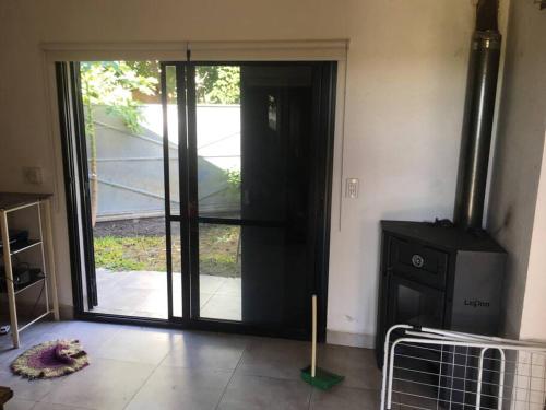 a living room with a door open to a patio at Casa en Gilbert, Entre Rios in Gilbert