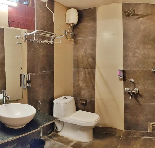 a bathroom with a toilet and a sink at Ocean Pearl Beach Resort, Havelock in Havelock Island