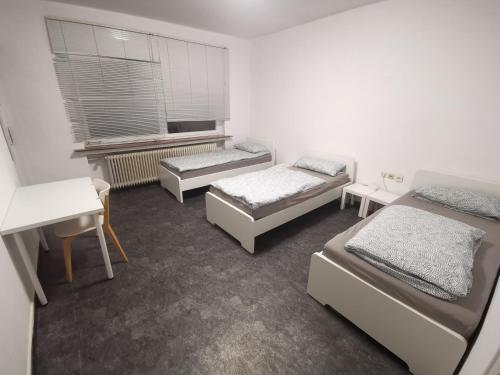 Łóżko lub łóżka w pokoju w obiekcie Linden Apartment - 15min to Fair