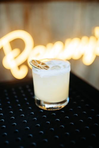 a drink sitting on top of a table at Penny's Motel in Thornbury