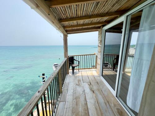 a balcony of a house with a view of the ocean at Hostel Santa Cruz del Islote in Santa Cruz del Islote