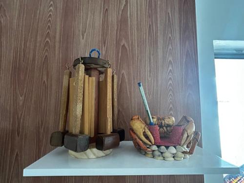 a shelf with a bunch of cricket equipment on it at Apto bem localizado est de Ribamar ao lado do shopping in São-José-do-Ribamar