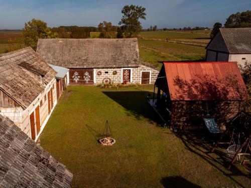 an aerial view of an old barn with a yard at Zielony Domek nad Biebrzą 