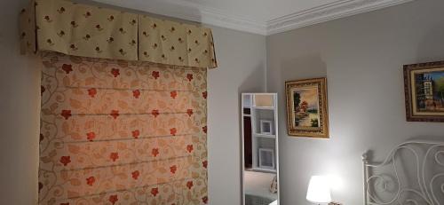 a room with a shower curtain and a mirror at piso en arenas de velez malaga in Málaga