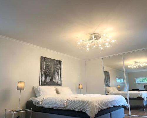 a bedroom with two beds and a ceiling fan at Elegant house Stockholm in Stockholm