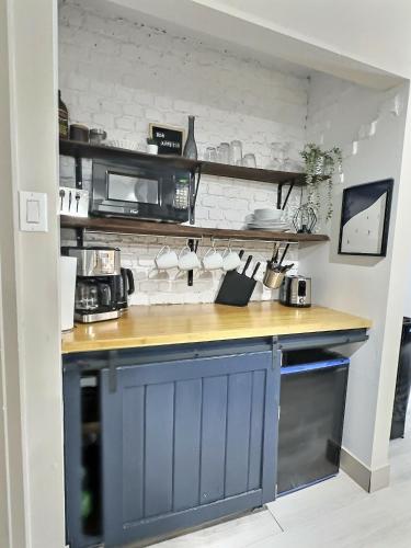 a kitchen with a blue island in a room at The Sunny Paradise in Mont-Tremblant