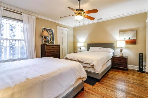 a bedroom with two beds and a ceiling fan at Brownstone in Gold Coast - Downtown in Chicago