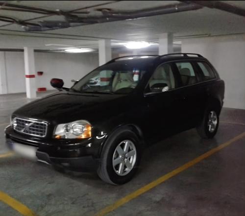 a black car parked in a parking lot at Ático Imperial GARAJE GRATIS Céntrico Terraza Aire Acond Solarium 2 baños wifi a 1minuto de la Plaza Cabildo in Sanlúcar de Barrameda