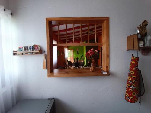 a mirror hanging on a wall in a room at Casa Campestre Buenavista, espacio natural in Ráquira