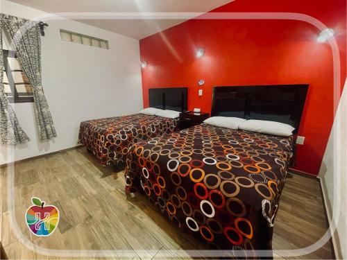 Voodi või voodid majutusasutuse HOTEL LA GRAN MANZANA toas