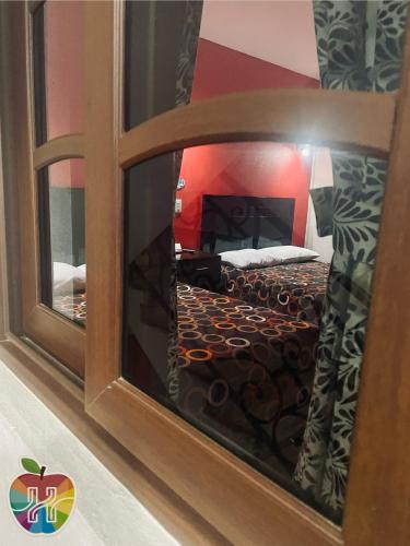 Voodi või voodid majutusasutuse HOTEL LA GRAN MANZANA toas