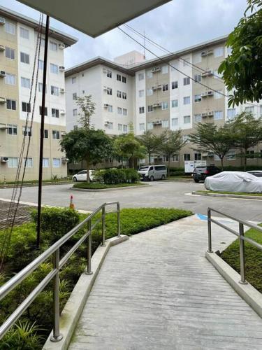 a walkway in front of a large building at Modern Simplicity: Cozy @Nuvali in Pitland