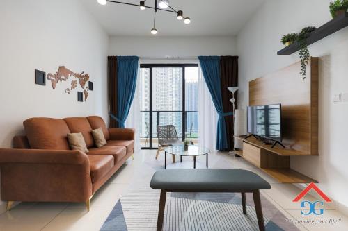 a living room with a couch and a tv at Astoria Ampang By Grabstay in Kuala Lumpur