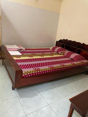 מיטה או מיטות בחדר ב-Nhà nghỉ Trang Thơ