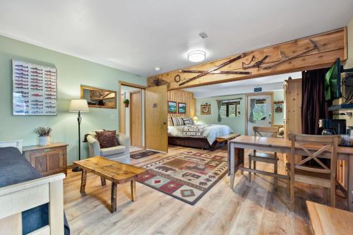 a living room with a couch and a table at Bear Lake Lodgings B&B in Seward