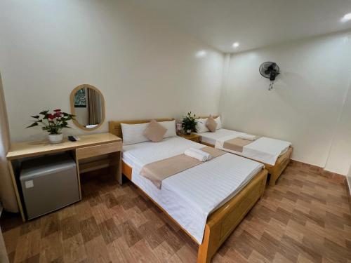 Ένα ή περισσότερα κρεβάτια σε δωμάτιο στο GOLDEN LAND HOTEL