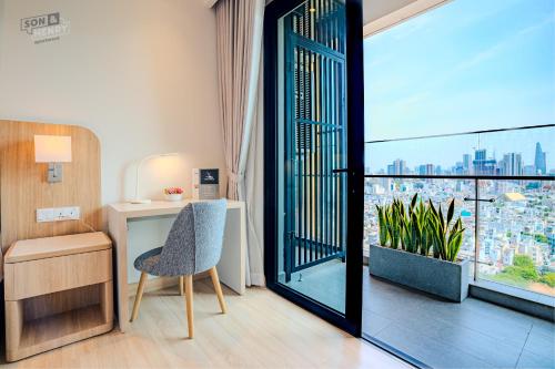 a room with a desk and a chair and a window at Son&Henry Zenity District 1 in Ho Chi Minh City