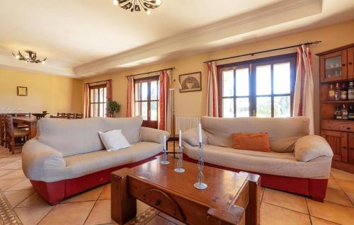 a living room with two couches and a coffee table at Stunning Home In Manacor in Manacor