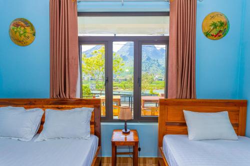 Ένα ή περισσότερα κρεβάτια σε δωμάτιο στο Son River Homestay