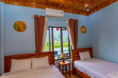 Ένα ή περισσότερα κρεβάτια σε δωμάτιο στο Son River Homestay