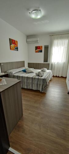 Ein Bett oder Betten in einem Zimmer der Unterkunft B&B Incanto Salento