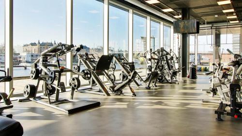 a gym with a bunch of tread machines in a building at Latin Quarter by Daniel&Jacob's in Copenhagen