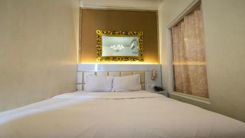 Tempat tidur dalam kamar di Premier Exclusive Guesthouse