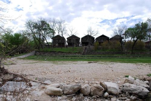 a group of cottages in a park with rocks at Cliff View #14 in New Braunfels