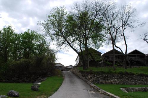 a road leading to a house with trees at Cliff View #14 in New Braunfels