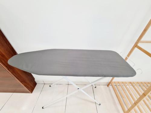 a gray table in a room next to a wall at 8 Guest 3 Room Casa Tiara Subang Parade Nu Empire Taylors Campus SJMC Sunway Pyramid Sunway Lagoon Sunway Medical Center in Subang Jaya