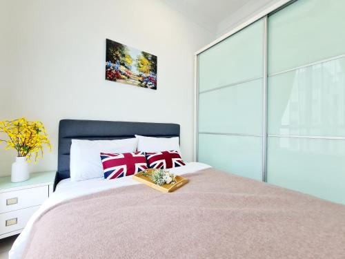 a bedroom with a bed with a tray on it at 8 Guest 3 Room Casa Tiara Subang Parade Nu Empire Taylors Campus SJMC Sunway Pyramid Sunway Lagoon Sunway Medical Center in Subang Jaya