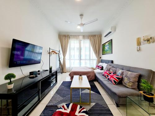 a living room with a couch and a flat screen tv at 8 Guest 3 Room Casa Tiara Subang Parade Nu Empire Taylors Campus SJMC Sunway Pyramid Sunway Lagoon Sunway Medical Center in Subang Jaya