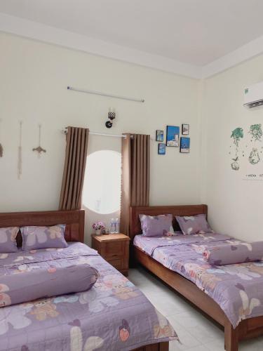 Cama o camas de una habitación en Homestay Hưởng Thụ - Nhơn Lý